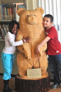 Walden Winter Carnival Committee Gifts Carved Bear to St. James