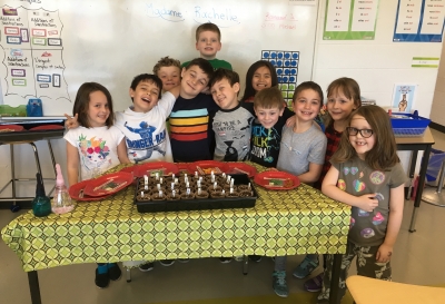 Planting for a good cause! Twin Forks Community Garden visits Holy Trinity students