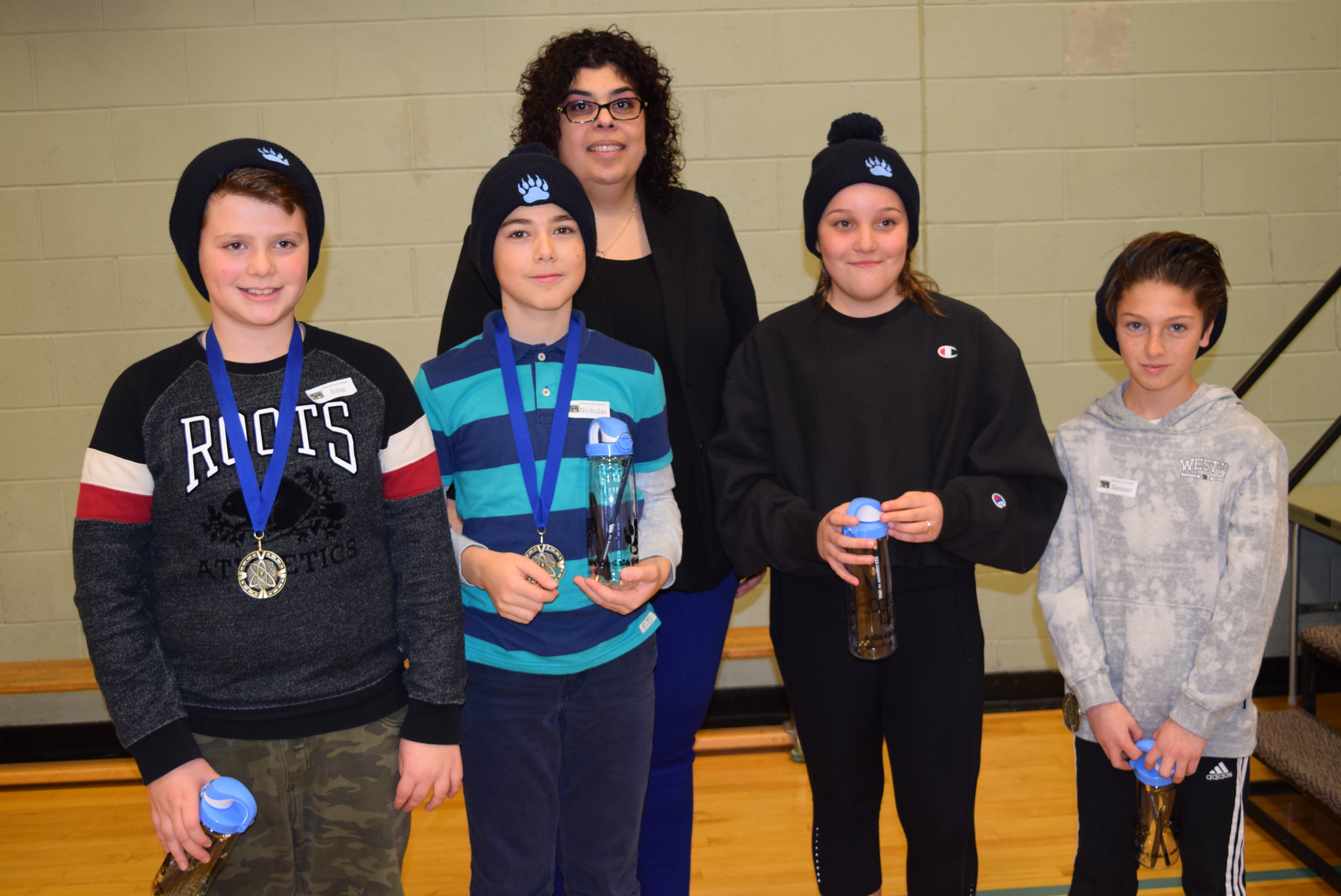 Holy Cross Students proudly show off their gold medals from the STEM competition.