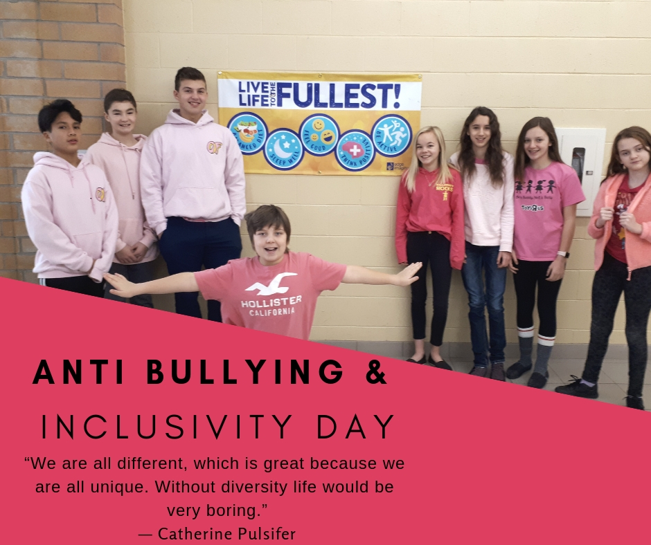Grade 7 students sneak out of their music class to stage a picture in the hallway showcasing their pink shirts in support of inclusivity.