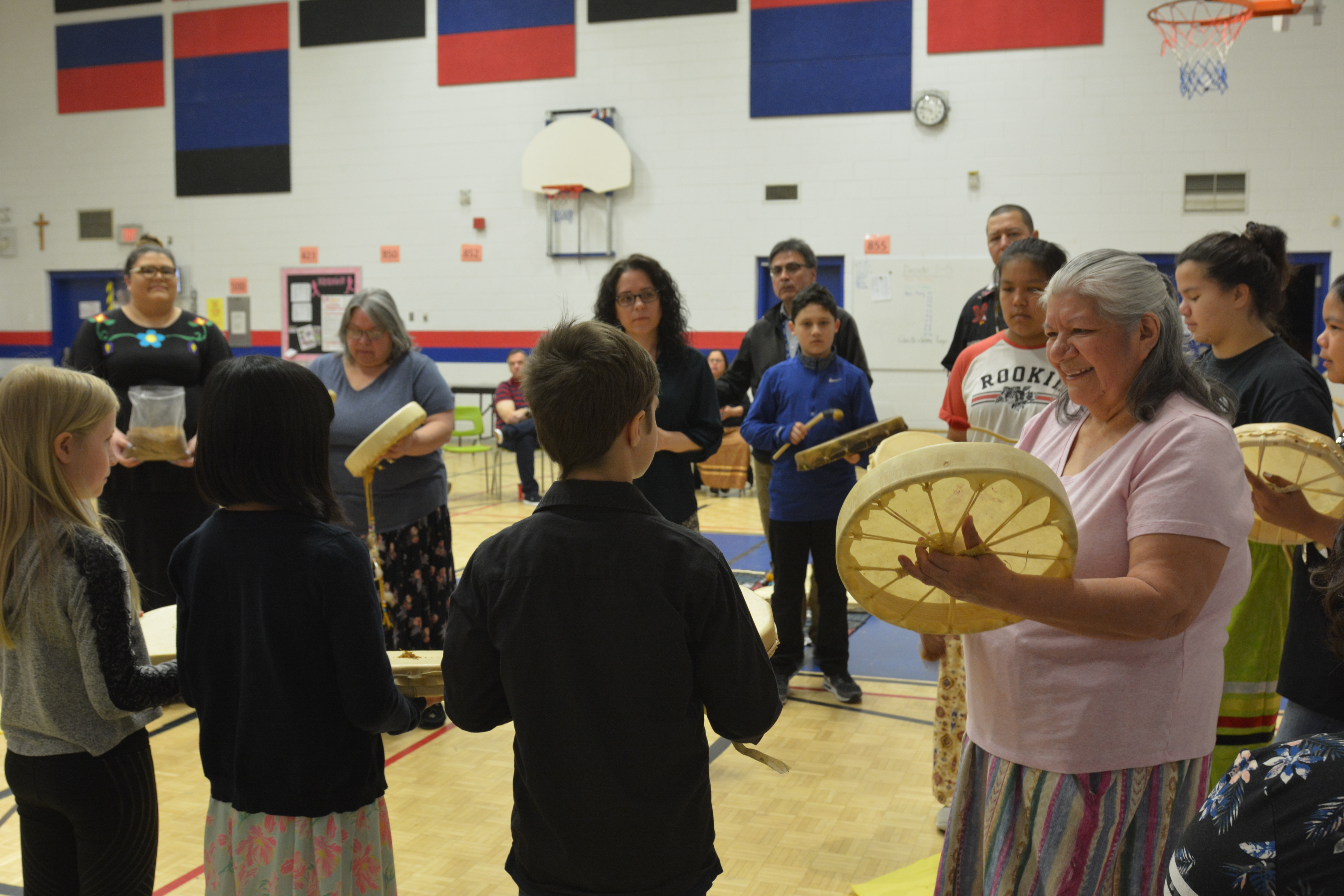Three St. James student participate in the birth and feast celebration alongside Elders and community partners.