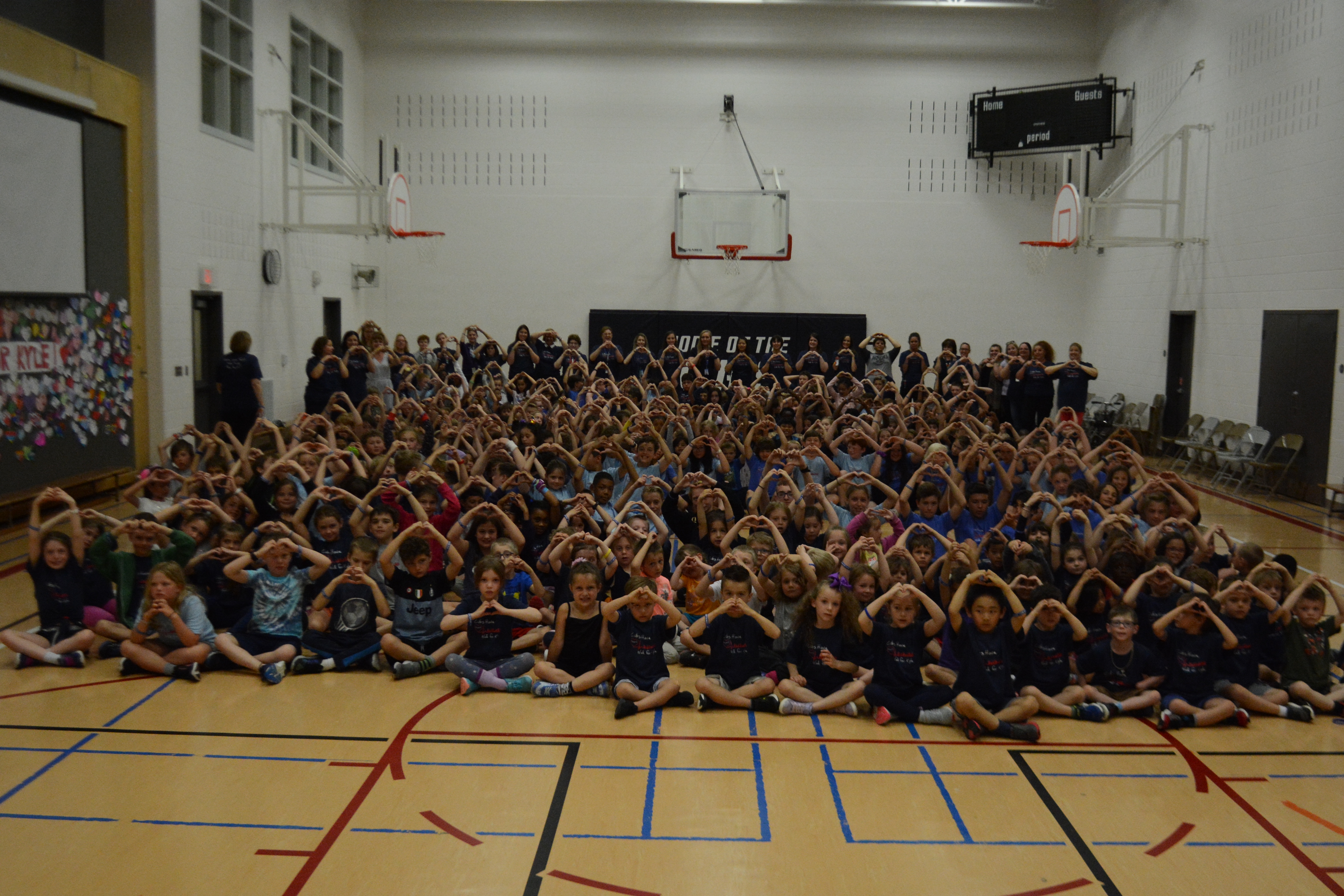 Entiire school sits in the gym