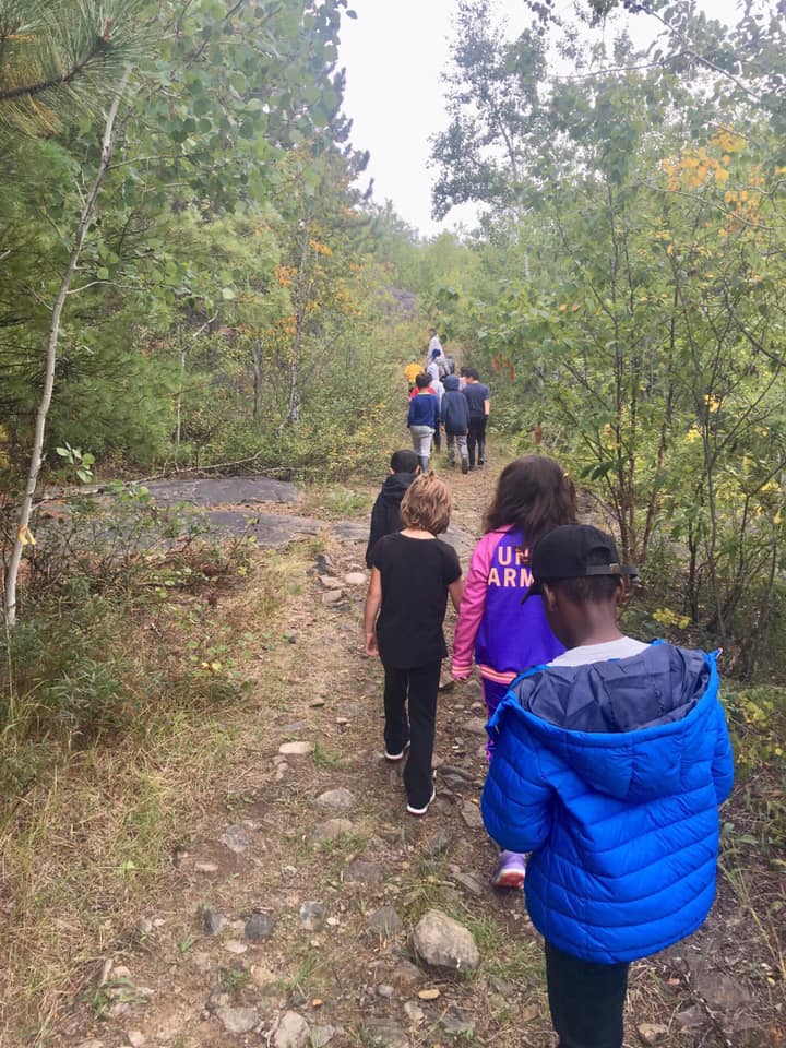 Students walking outdoors.