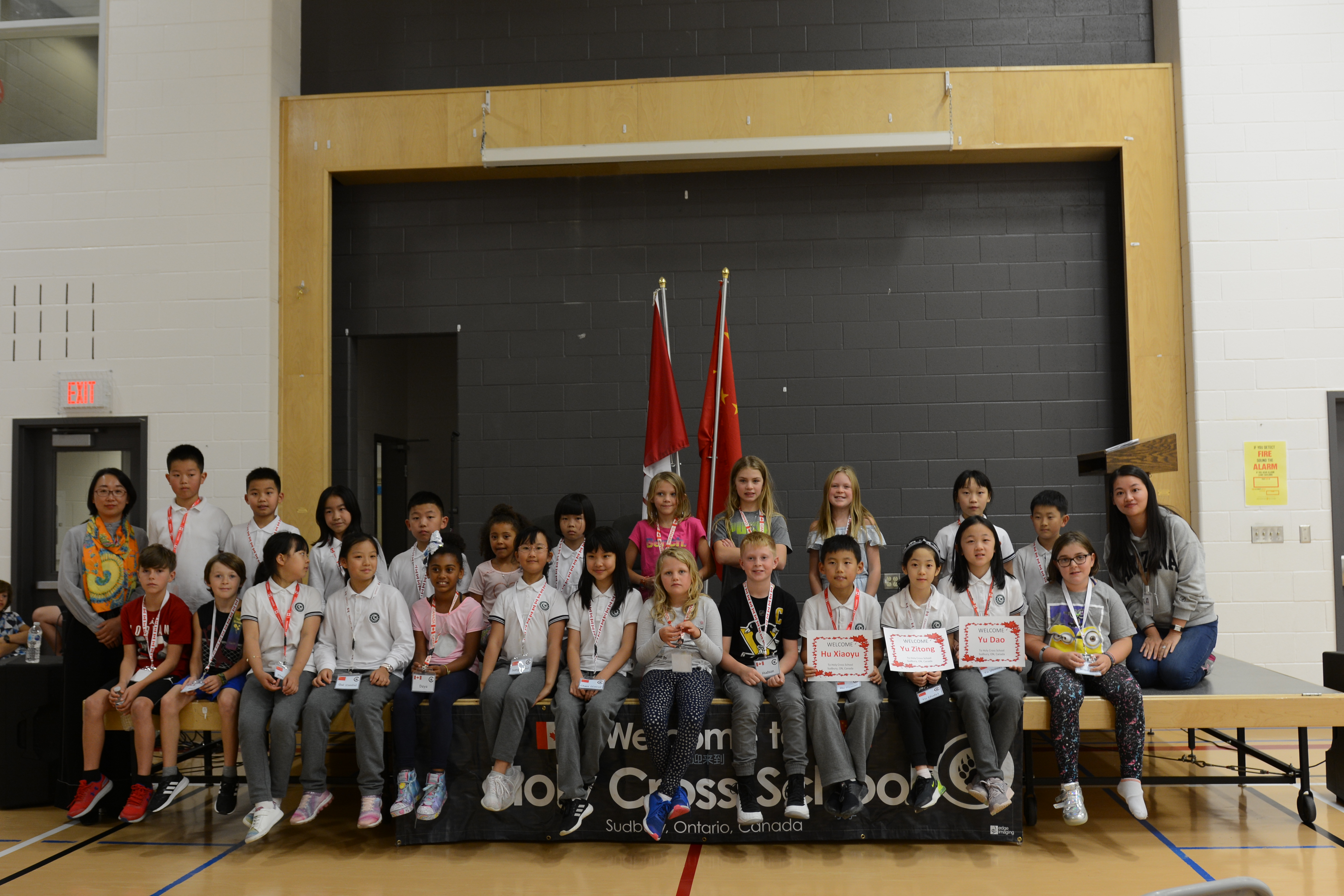 Visiting Chinese students pose with their host students from Holy Cross.