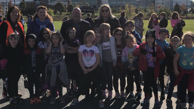 St. Francis staff and students stand outside.