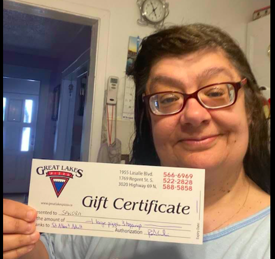 Woman holds gift certificate