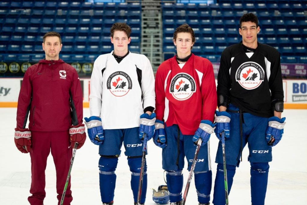 Athletic Director and Hockey Canada Skills Academy Lead Darren Michelutti with Jack Thompson, Chase Stillman and Quinton Byfield.