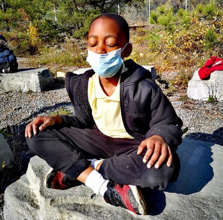 A boy meditates