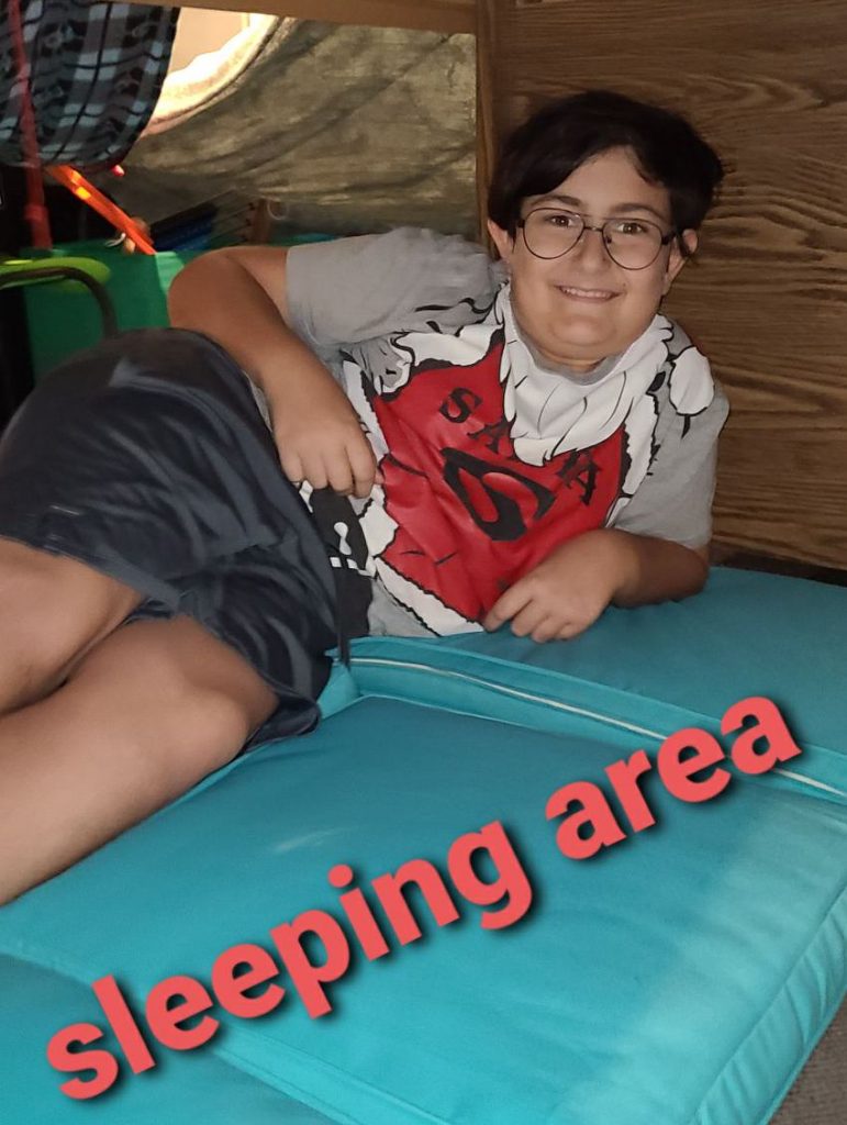 Owen sits in his fort