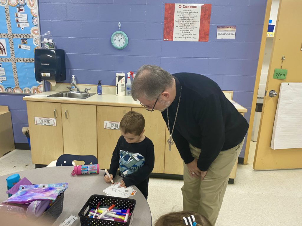 The Bishop talks with a student