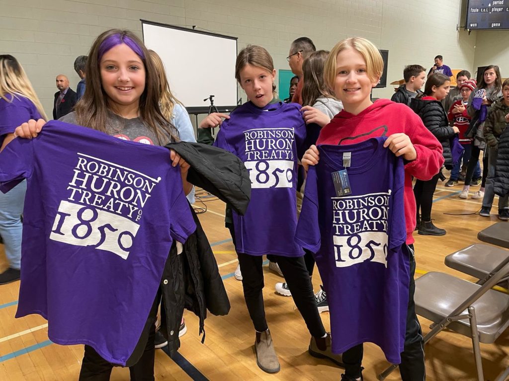 Students Stand with T Shirts