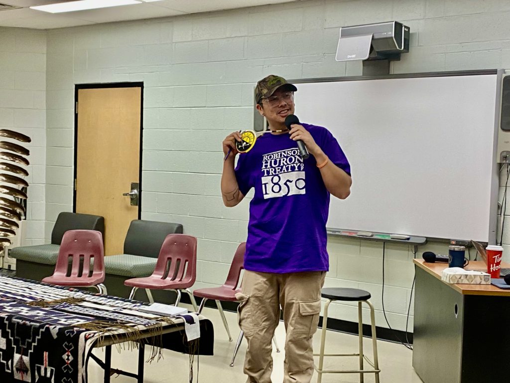 Man stands with t shirt